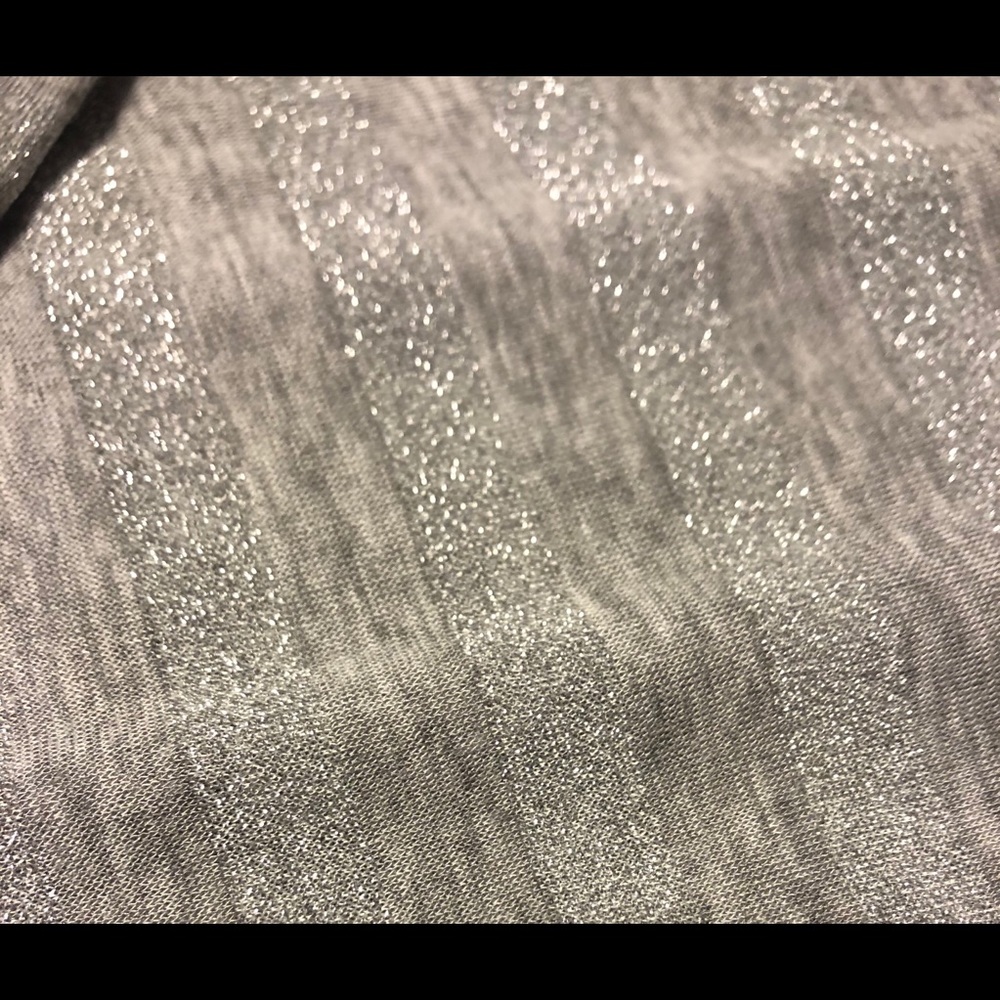 Sleeveless silver sparkly long dress.